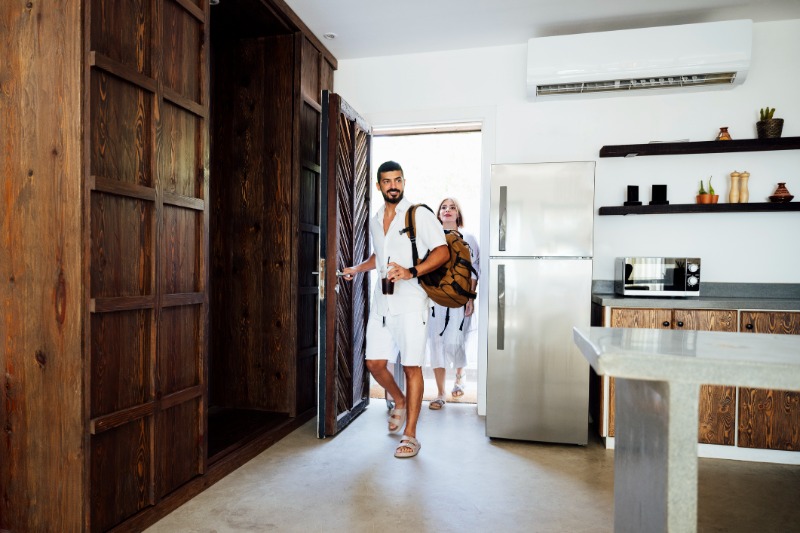 couple entering resort guest room